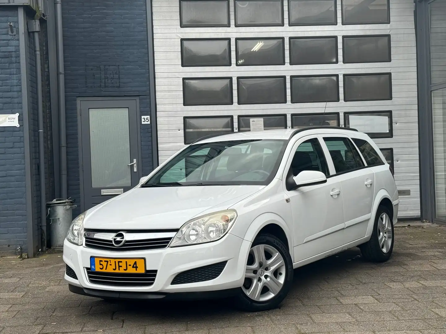 Opel Astra Wagon 1.6 Business | Airco | Navi | Cruise | PDC Wit - 1