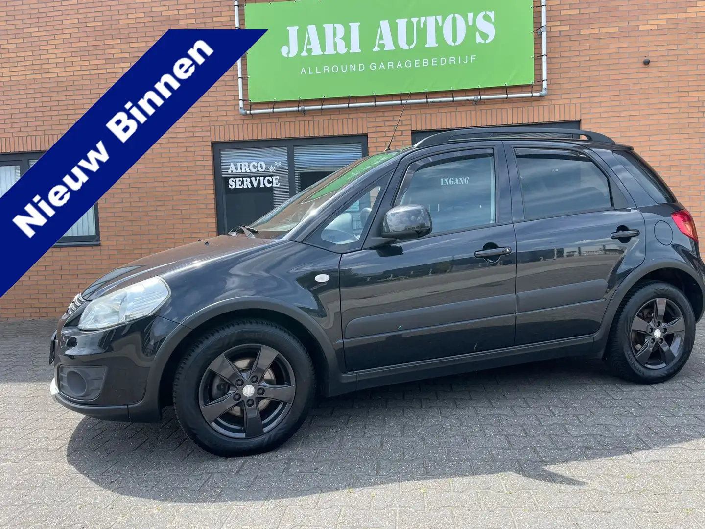 Suzuki SX4 1.6 Exclusive Airco Zwart - 1