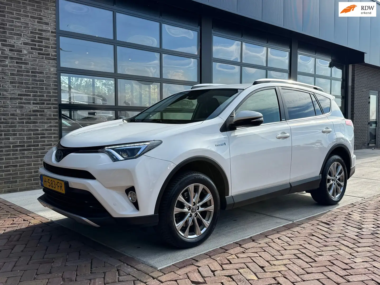 Toyota RAV 4 2.5 Hybrid AWD Style | Trekhaak | Autm | Navi | Cl Bianco - 1