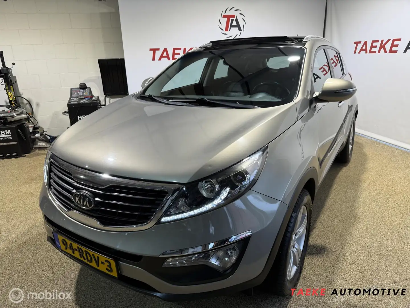 Kia Sportage 2.0 X-ecutive PlusPack APK/NAP/CLIMA/PANO/CRUIS Grau - 1
