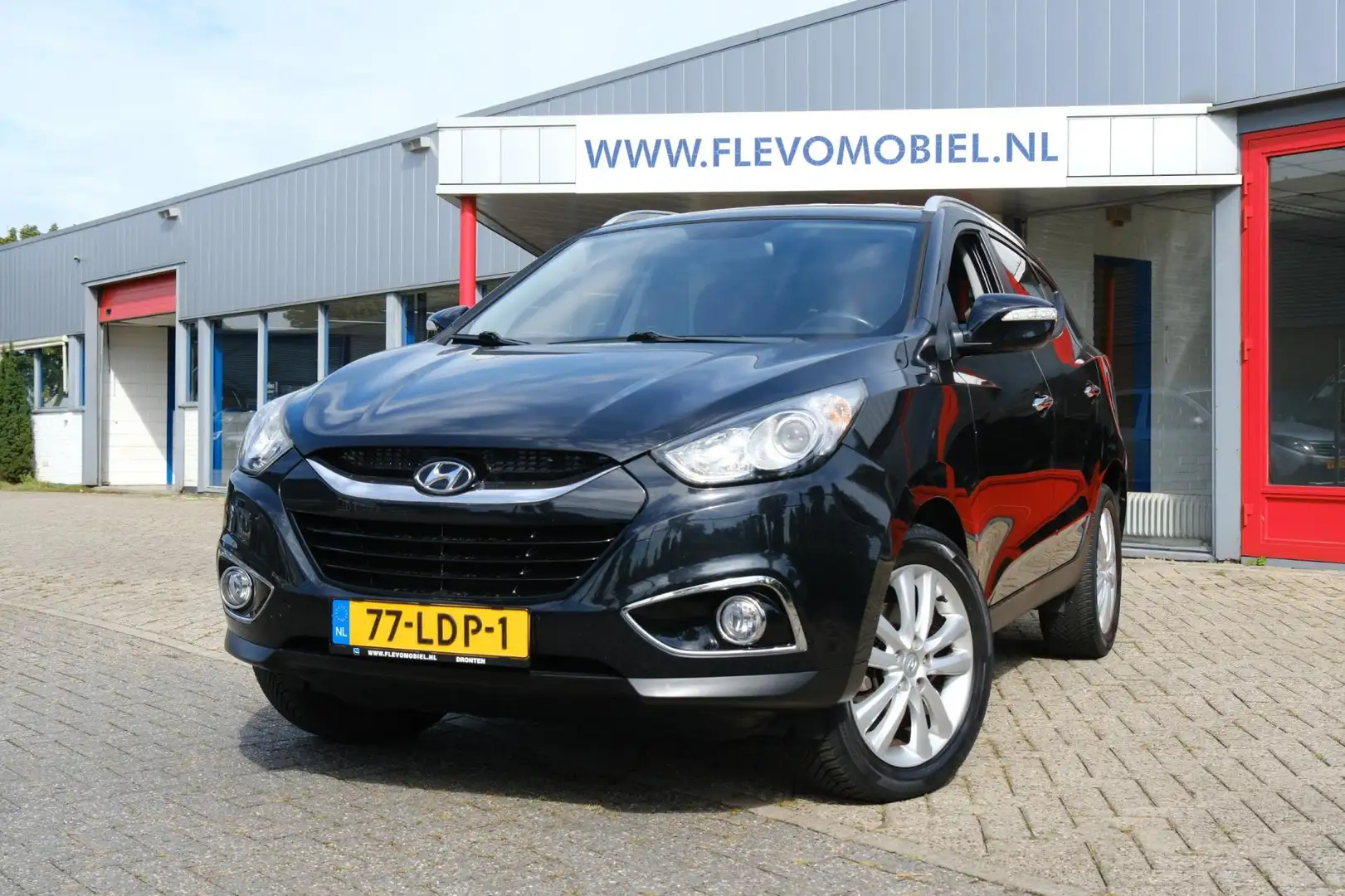 Hyundai iX35 2.0i Style Half leder|Clima|Cruise|Trekhaak|LMV Zwart - 1