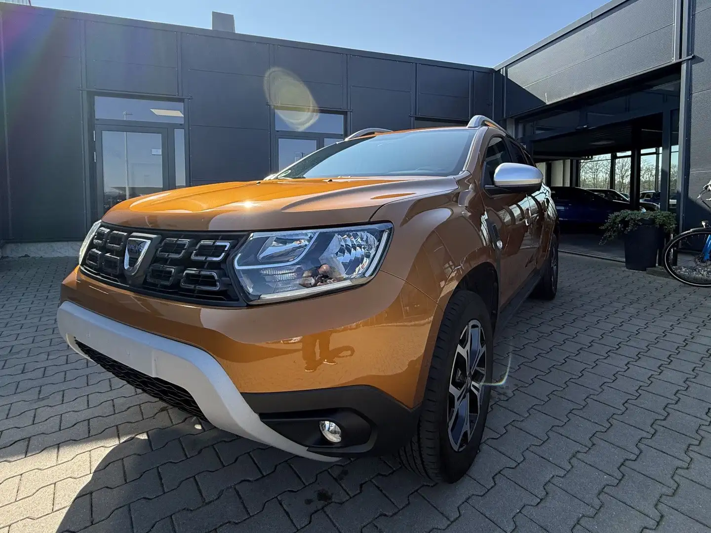 Dacia Duster II 1.3 TCE Anniversary Oranje - 1