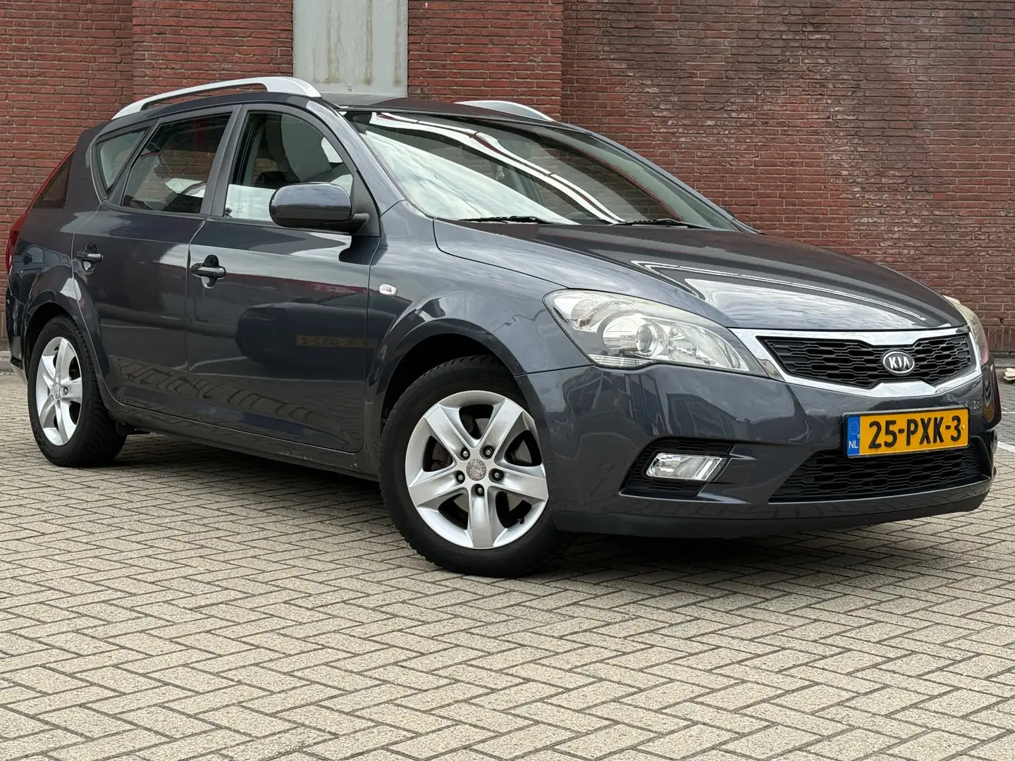 Kia Ceed / cee'd Sporty Wagon 1.4 CVVT Seven|AIRCO|NAVI|R.CAMARA|CR Grijs - 1