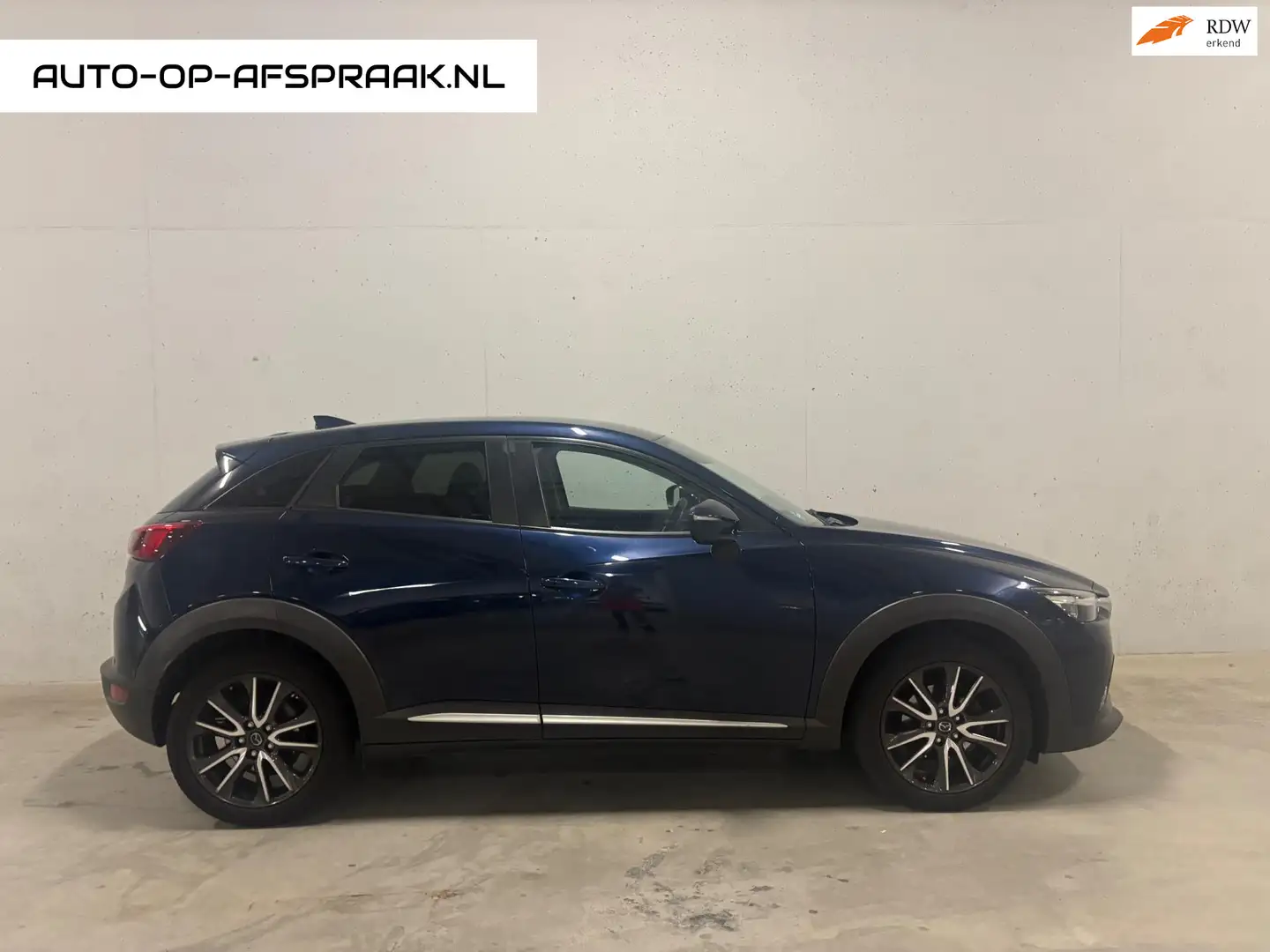 Mazda CX-3 2.0 SkyActiv-G 120 Dynamic Automaat Navi Cruise Blauw - 1