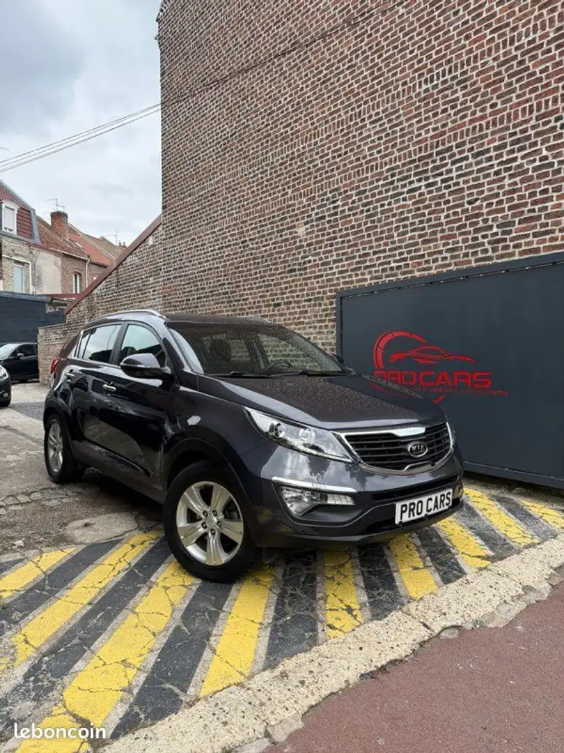 Kia Sportage Gris - 1