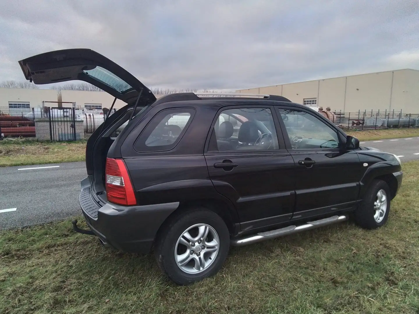 Kia Sportage 2.0 CVVT Executive Zwart - 1