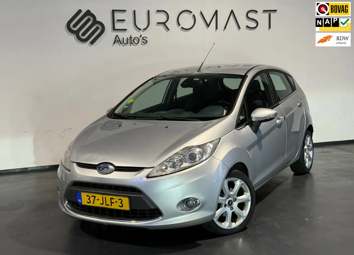 Ford Fiesta 1.25 Titanium Airco Cruise Pdc 5d Nieuwe Apk Grijs - 1