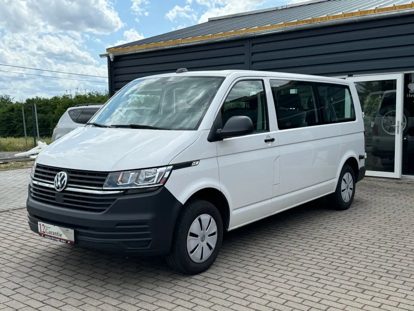 Volkswagen T6 Transporter T6.1*GARANTIE*8Sitzer*Klima*Navi*PDC*1.Hand*Lang Blanc - 1