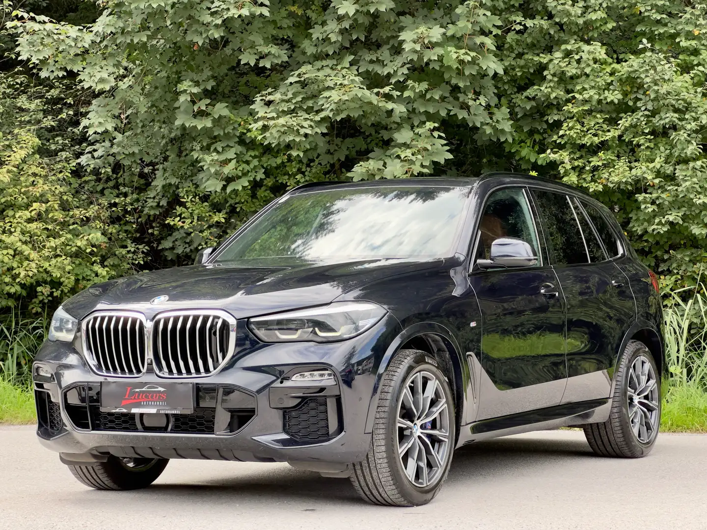 BMW X5 xDrive 30 d M Sport *INDIVIDUAL*360KAM*AHK*NVISION Zwart - 1