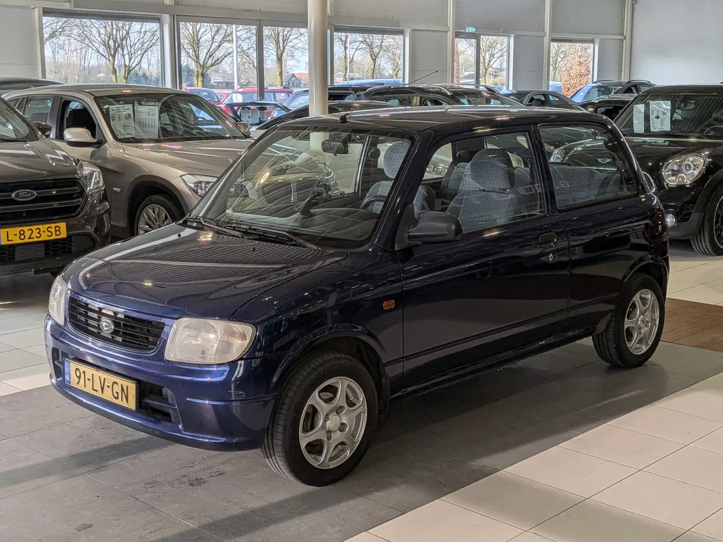 Daihatsu Cuore 1.0-12V DVVT STi Automaat NAP 65.196km Azul - 2