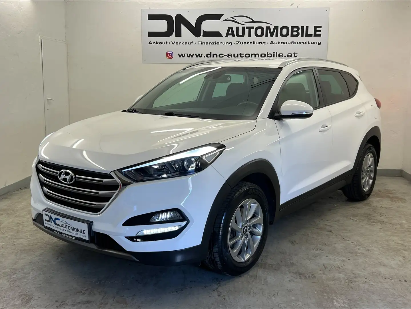 Hyundai TUCSON 2,0 CRDI 4WD Style Aut. Weiß - 1