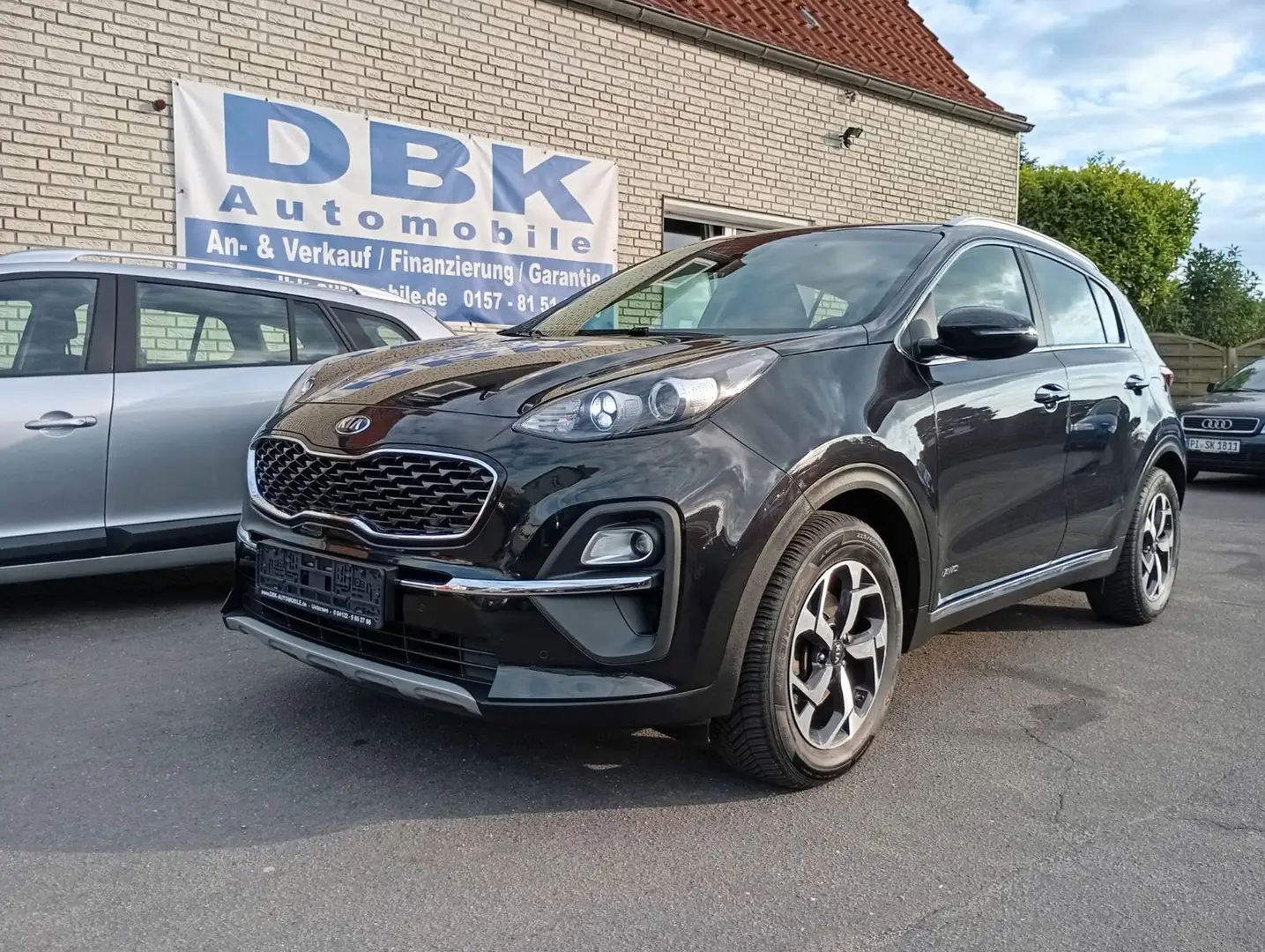 Kia Sportage Vision 4WD 1.HD Scheckh. Automatik Navi Schwarz - 1