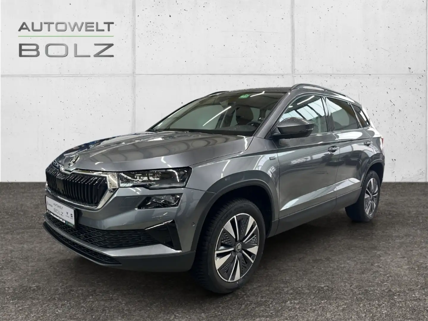 Skoda Karoq Selection 1.5 TSI AHK Pano Navi DigiCock Memory Si Grau - 1