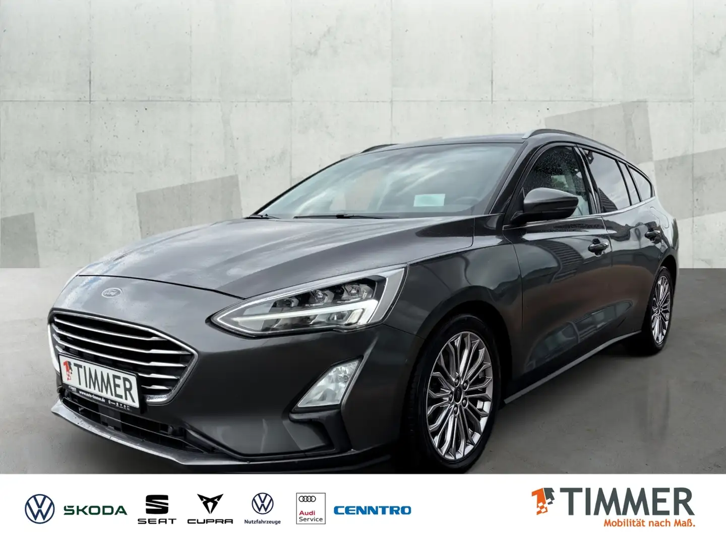 Ford Focus Turnier 1.5 Titanium*Automatik*PANO*R-Kam*PDC*NAV Grijs - 1