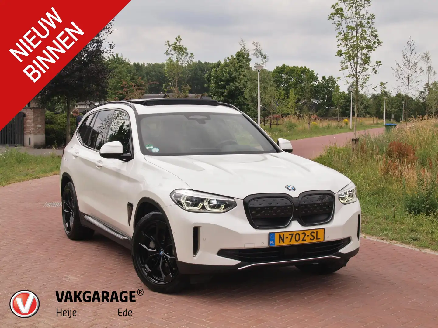 BMW iX3 High Executive 80 kWh | Panoramadak | Trekhaak | N Wit - 1