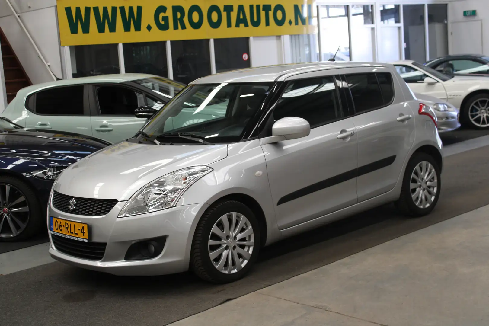 Suzuki Swift 1.2 Exclusive Automaat 1e eigenaar NAP, Airco, Cru Gris - 1
