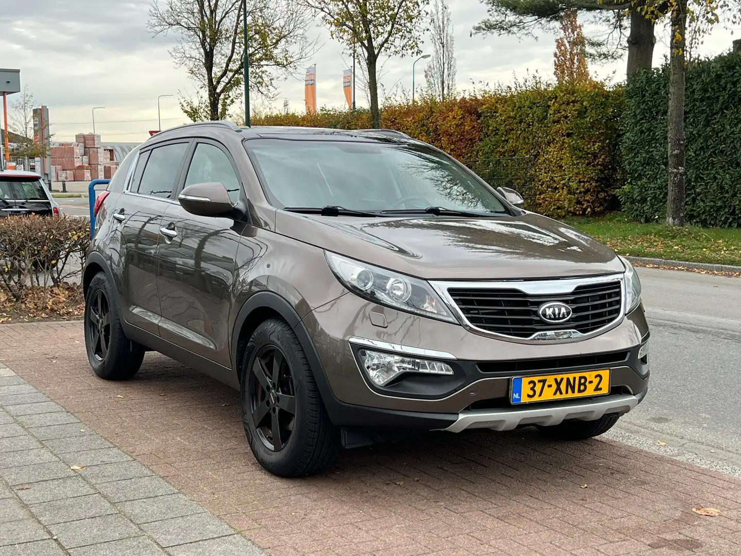 Kia Sportage 1.6 GDI ISG X-clusive | Pano|navi|leder Brun - 1