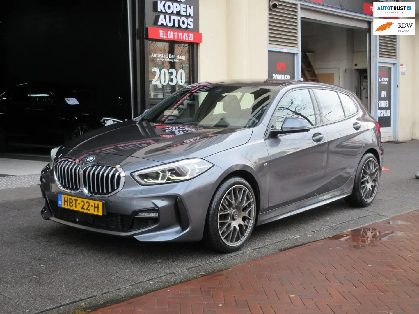 BMW 118 1-serie 118i High Executive M Sport Aut Navi Leer Grijs - 1