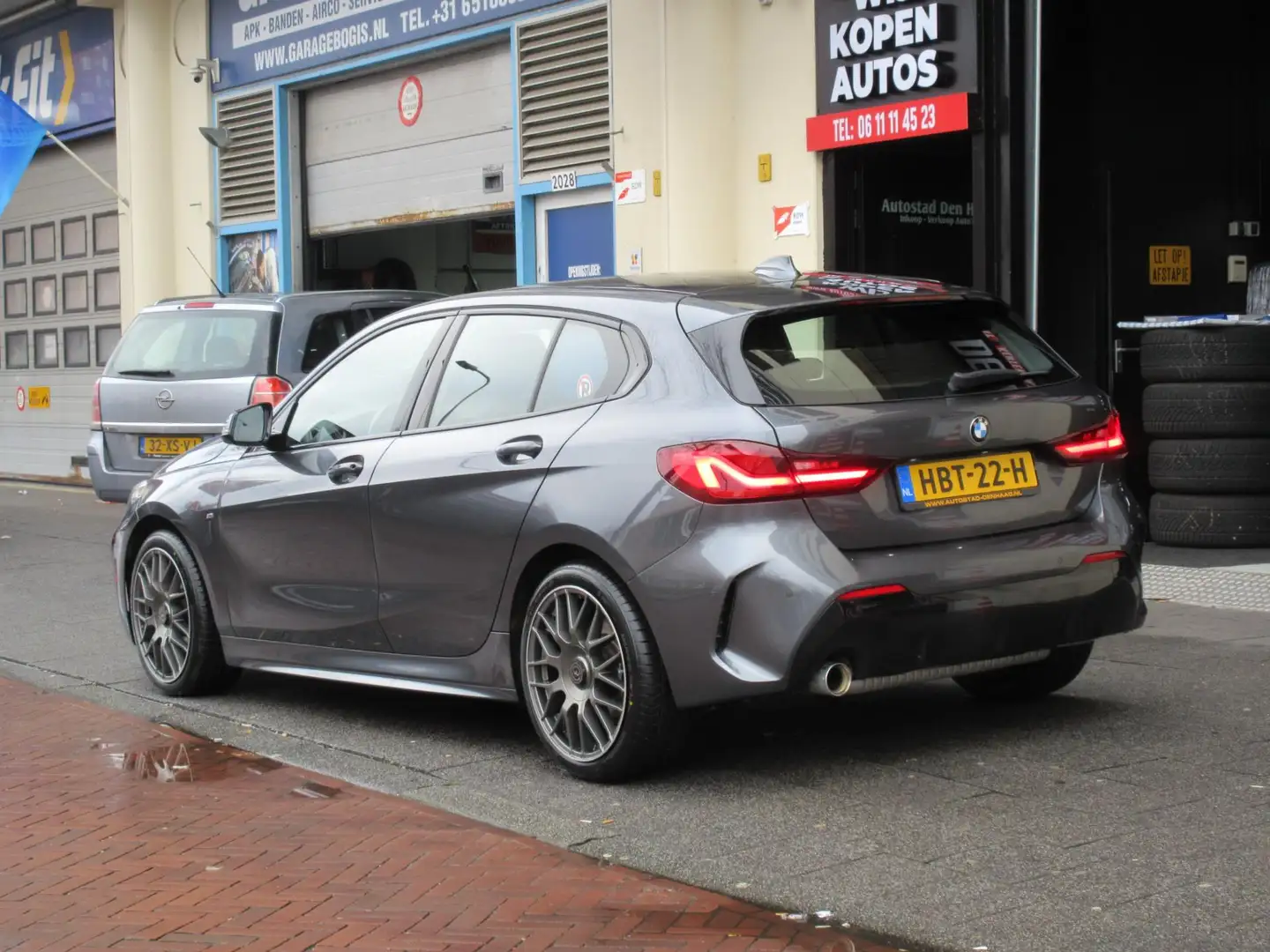 BMW 118 1-serie 118i High Executive M Sport Aut Navi Leer Grijs - 2