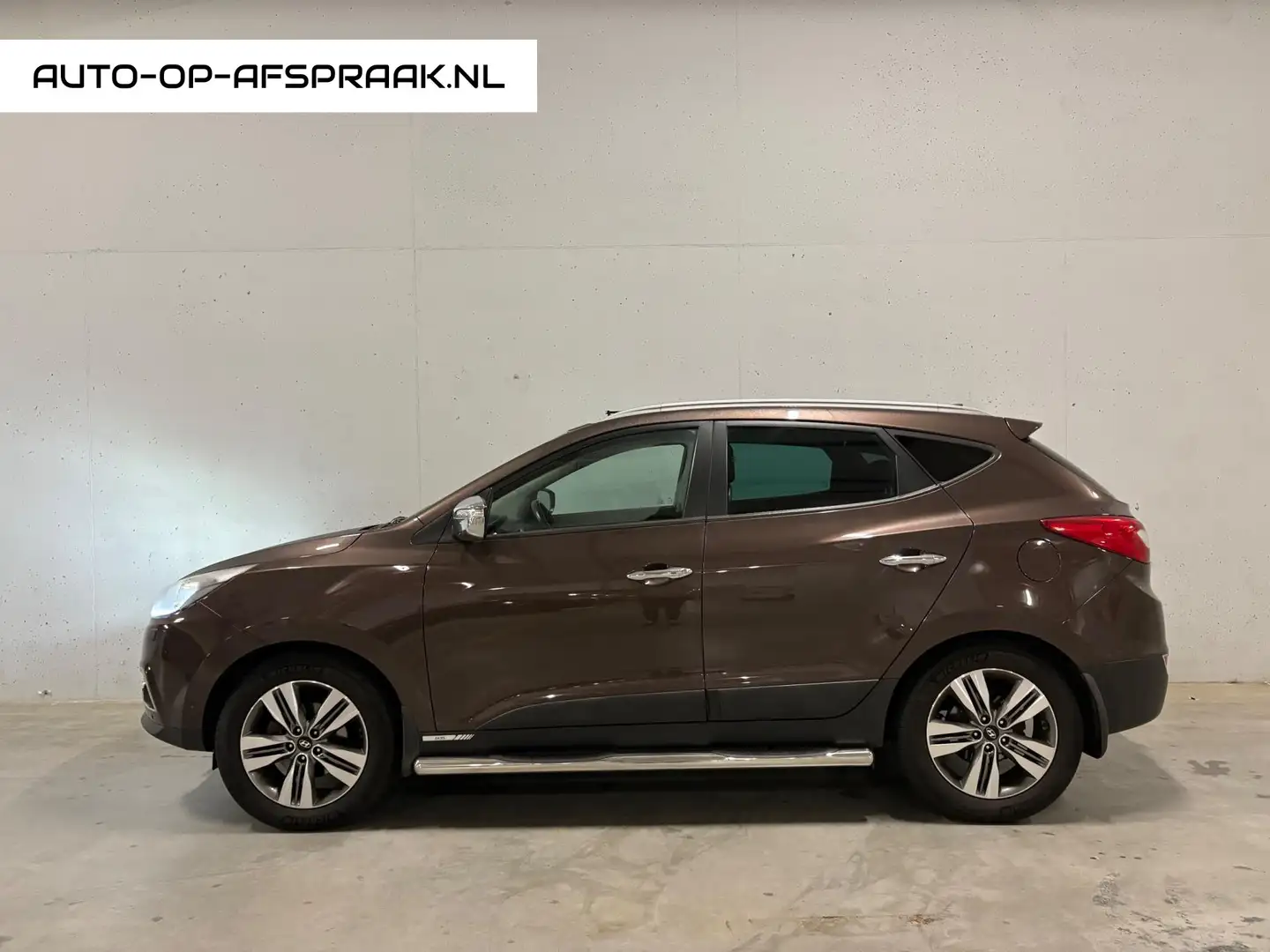 Hyundai iX35 2.0i 4WD i-Catcher Automaat Leer Pano Trekhaak Cam Bruin - 1