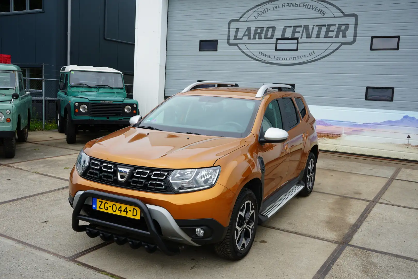 Dacia Duster 1.3 TCe Prestige 150 pk motor Naranja - 1