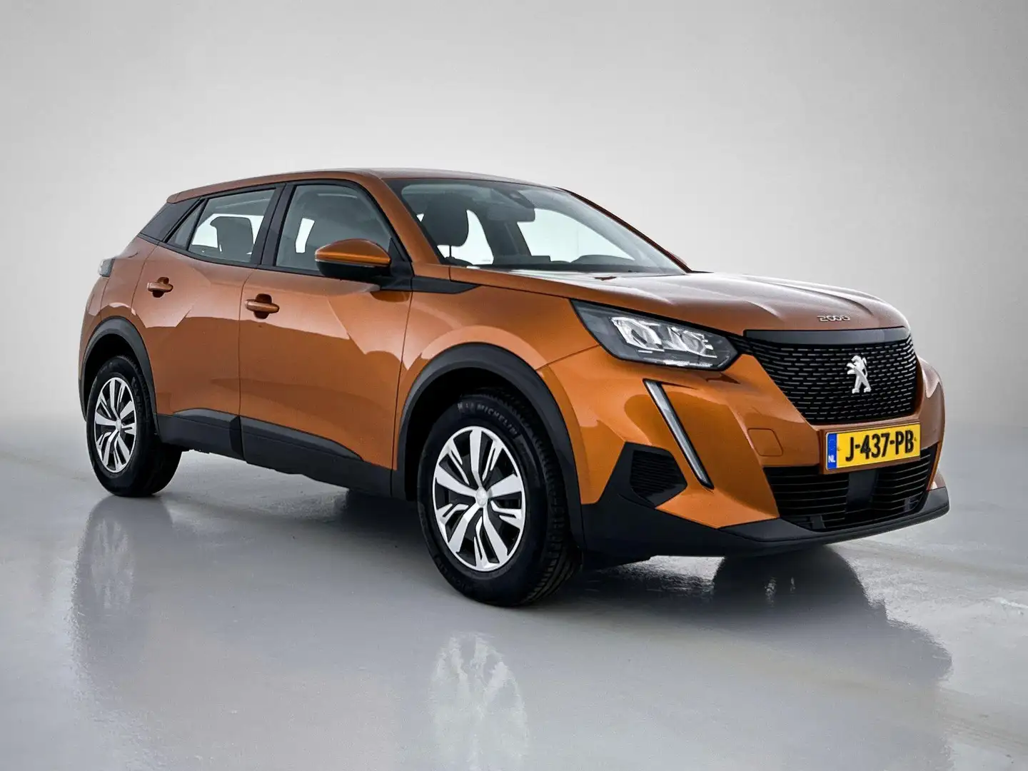 Peugeot 2008 SUV Active 100pk | Navigatie | Airco | Cruise Cont Orange - 2