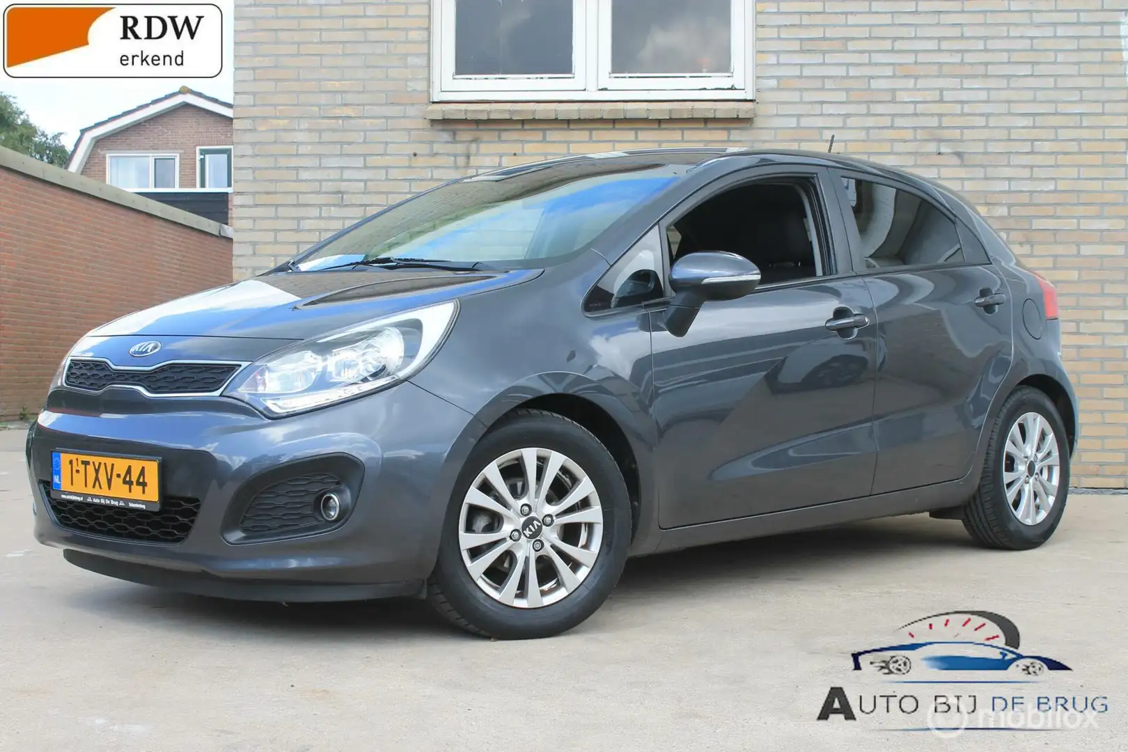 Kia Rio 1.2 CVVT World Cup Edition Plus CLima Airco Leer Gris - 1