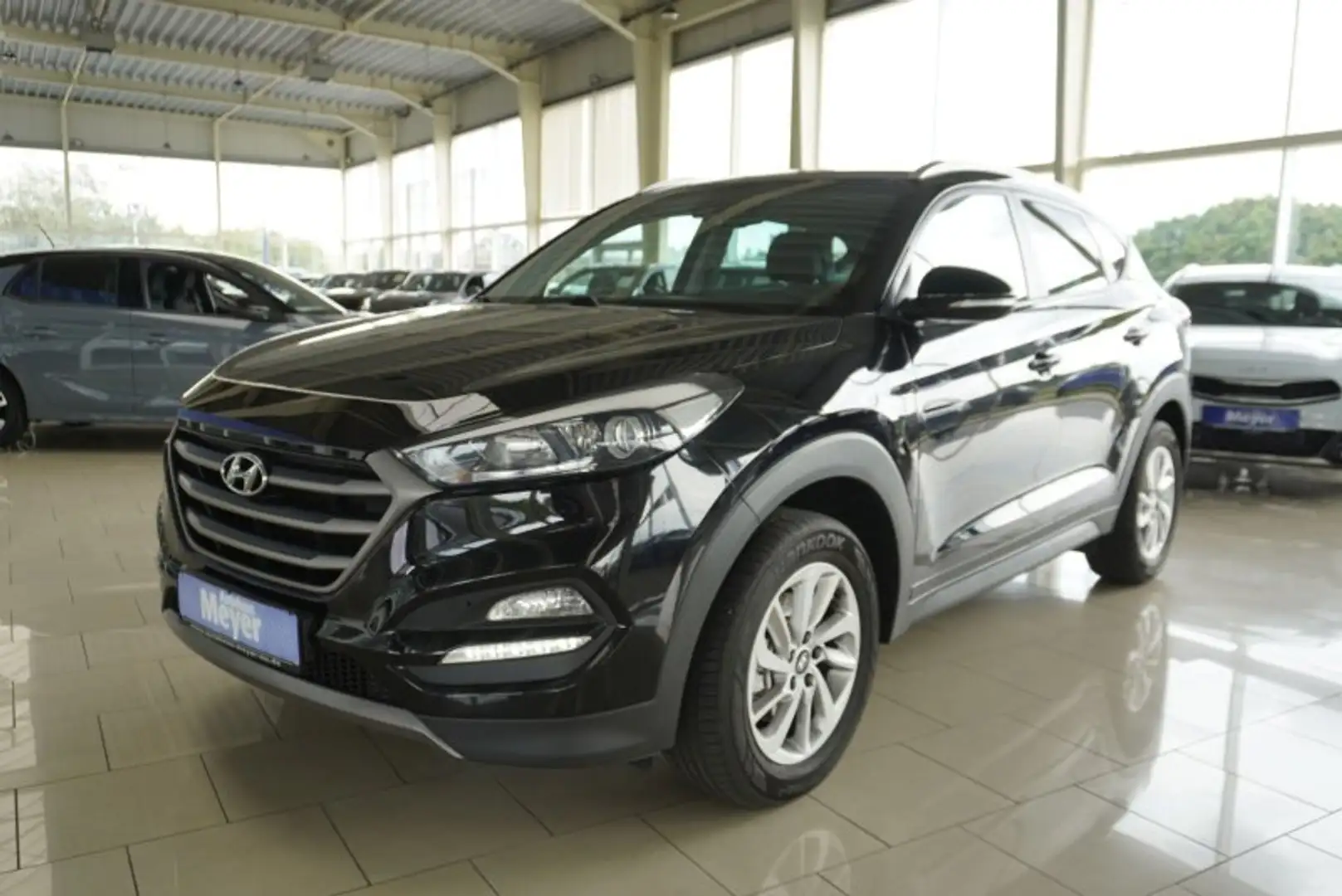 Hyundai TUCSON 1.6 132PS Navi/Kamera/Winterp/2-Z.Klimaaut. Black - 1