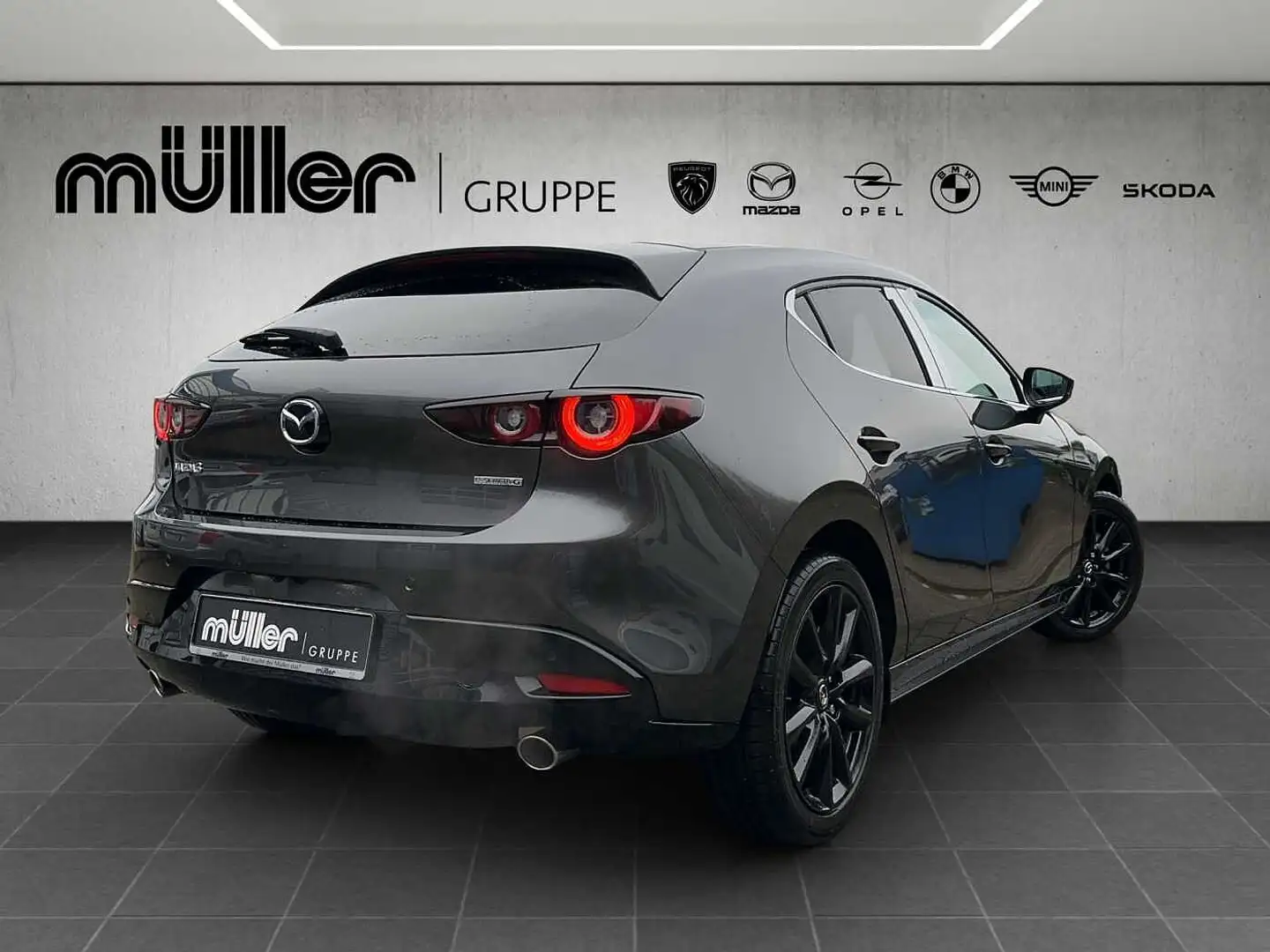 Mazda 3 G 140 PS 6AT FWD HOMURA 2025 Mazda3 5HB 2.5L e-SKY Grijs - 2