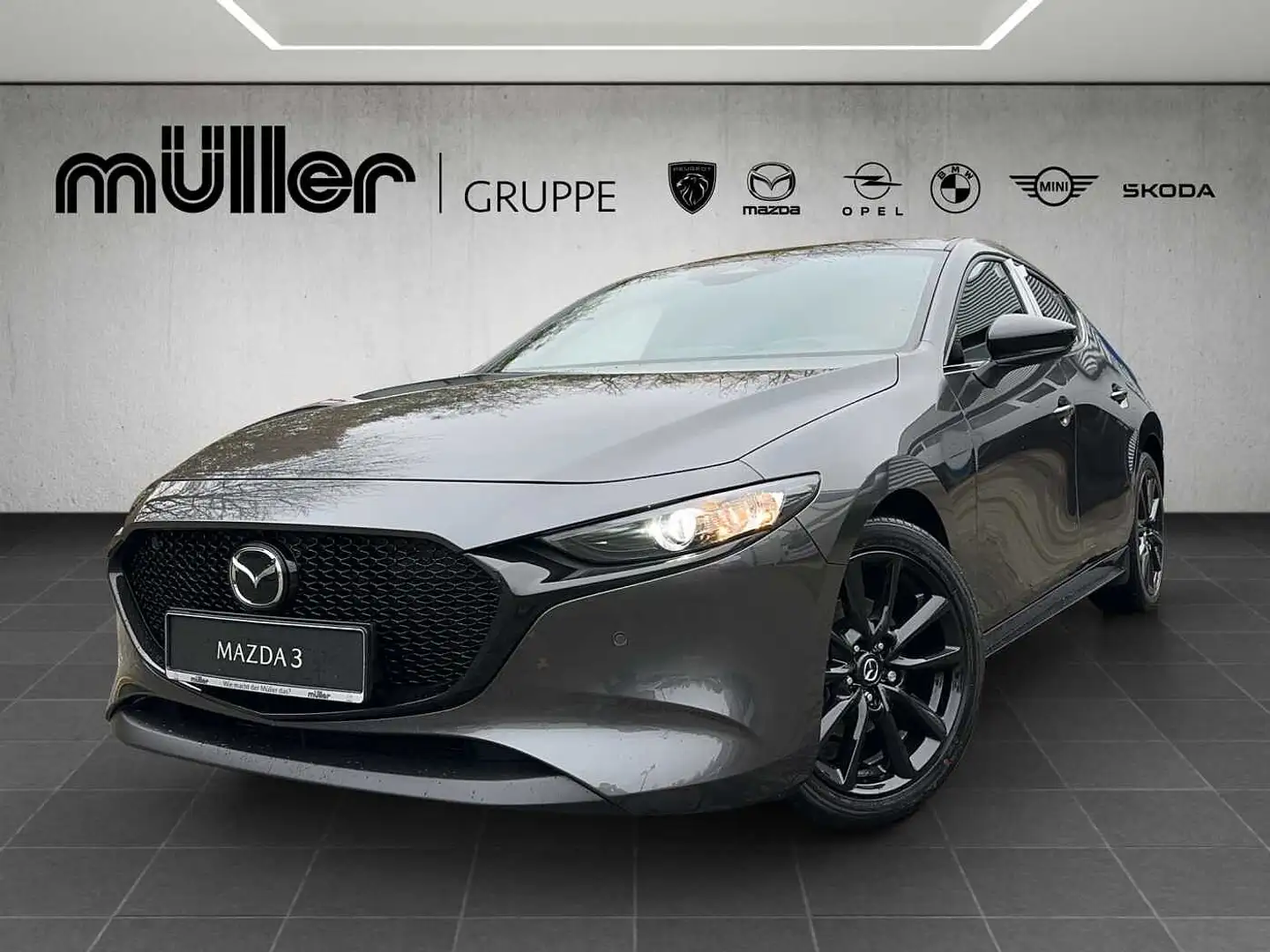 Mazda 3 G 140 PS 6AT FWD HOMURA 2025 Mazda3 5HB 2.5L e-SKY Grau - 1