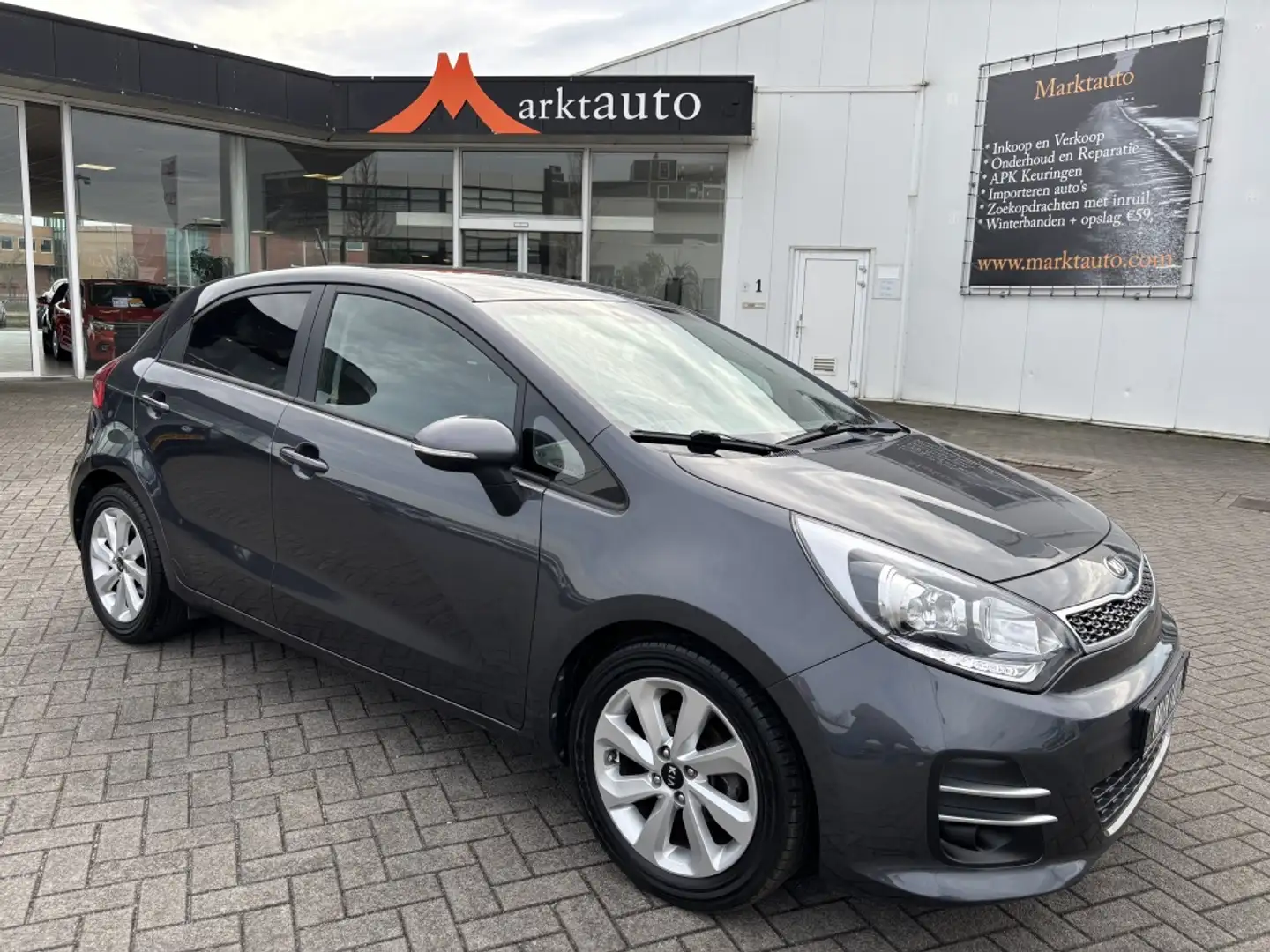 Kia Rio 1.2 CVVT Comfort Plus Navi Camera Cruise Bluetooth Grijs - 1