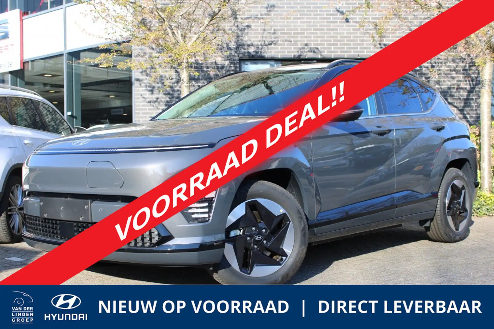 Hyundai KONA Electric 65.4 kWh Comfort Smart + BCA | Navi | Pdc Grijs - 1