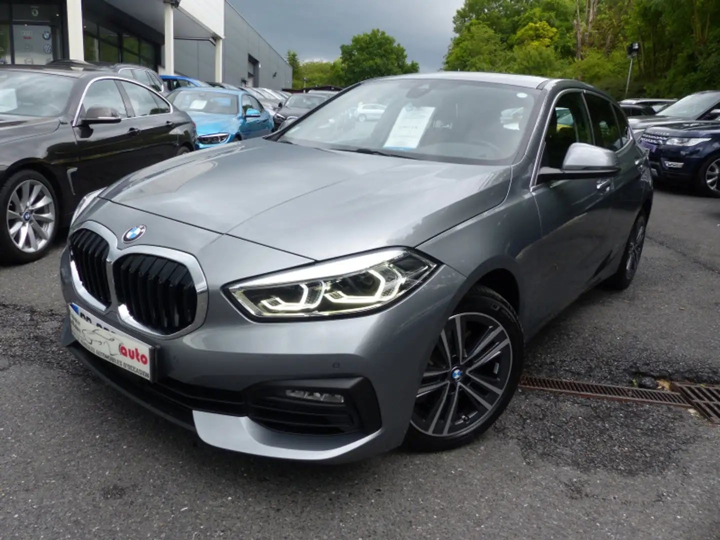 BMW 116 (F40) 116IA 109CH BUSINESS DESIGN DKG7 Gris - 1