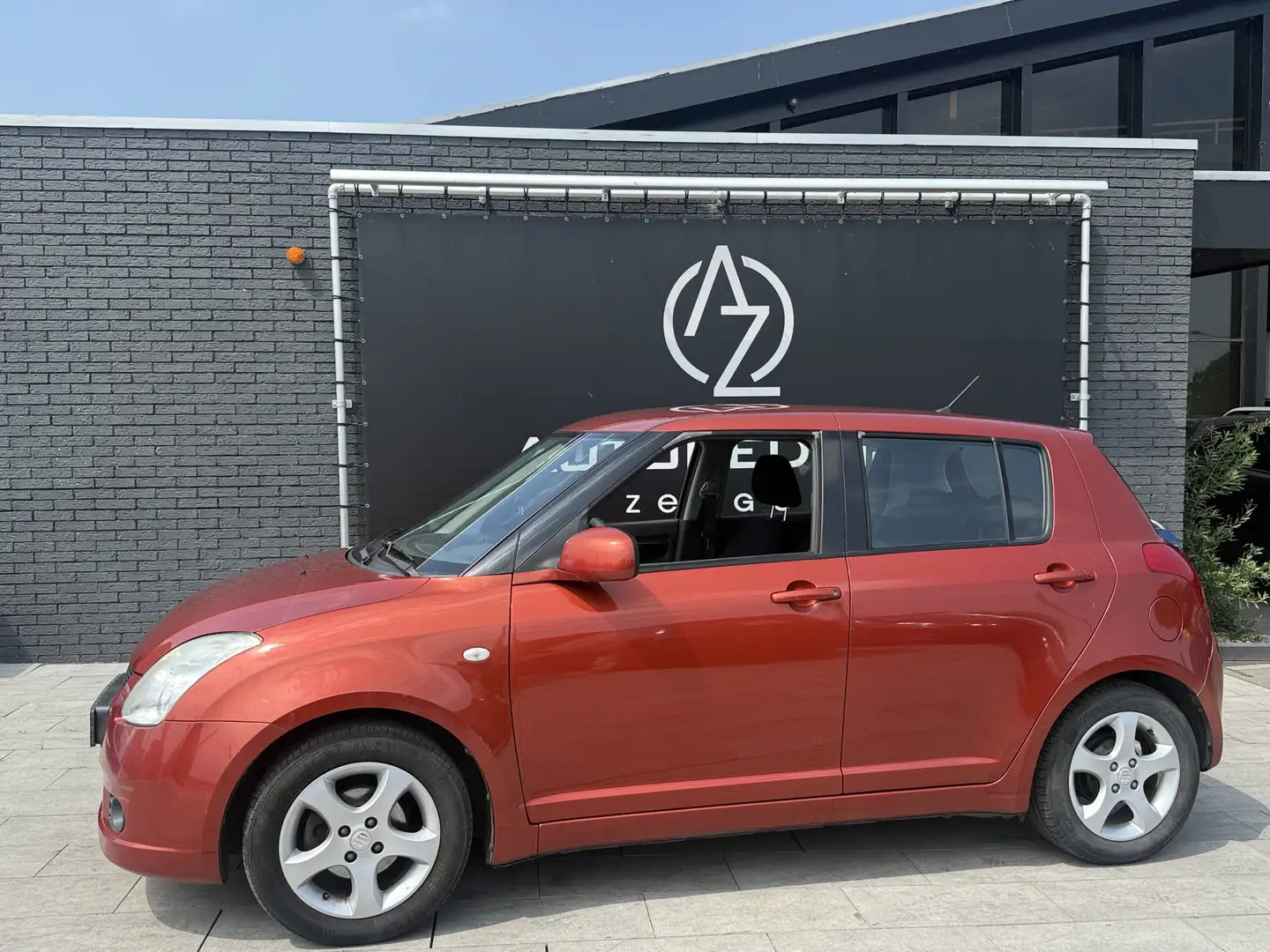 Suzuki Swift 1.3 Shogun Airco*5deurs*KETTING* Oranje - 1