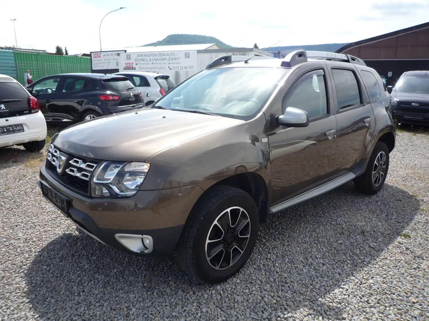 Dacia Duster Prestige 4x2*NAVI*KAMERA*TÜV 3/27*SHZ*TEMPOMAT Braun - 1