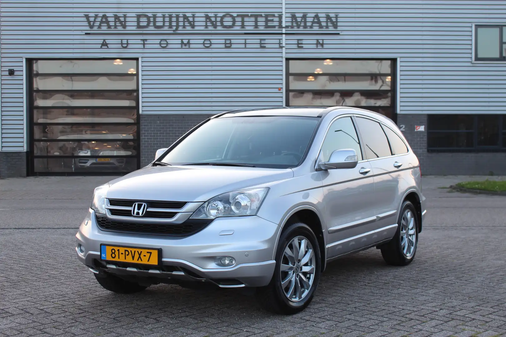 Honda CR-V 2.0i Executive 4WD / Leer / Camera / N.A.P. Grau - 1
