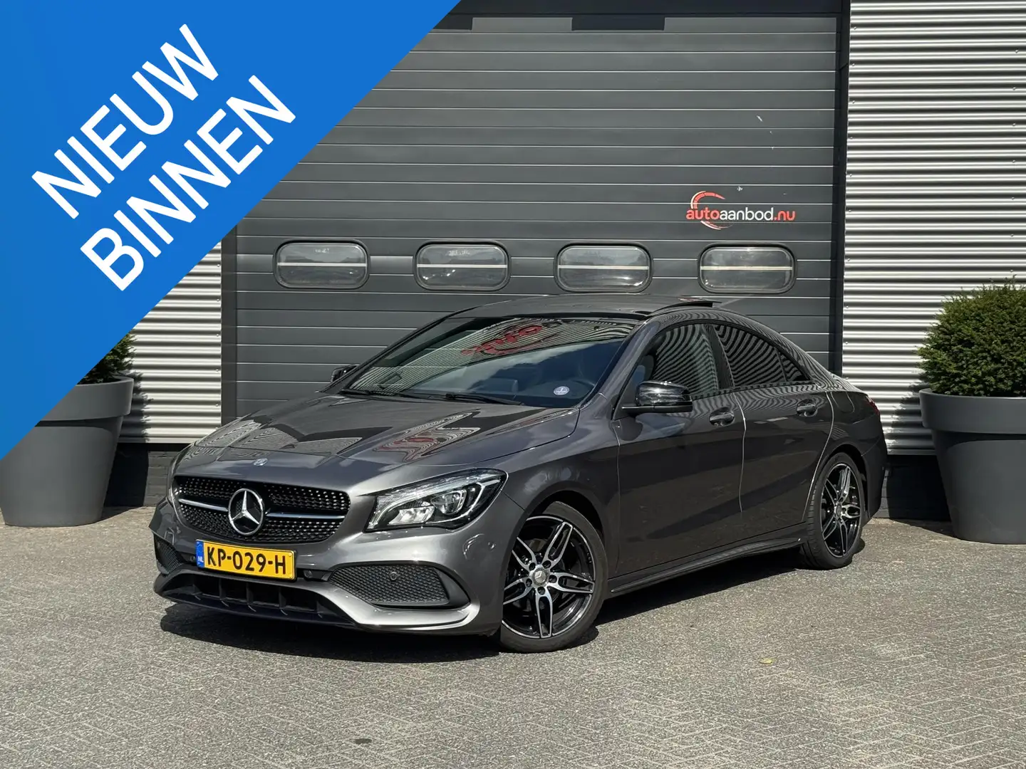 Mercedes-Benz CLA 180 AMG Night Edition Plus | Panoramadak | Carbon | Na Grijs - 1