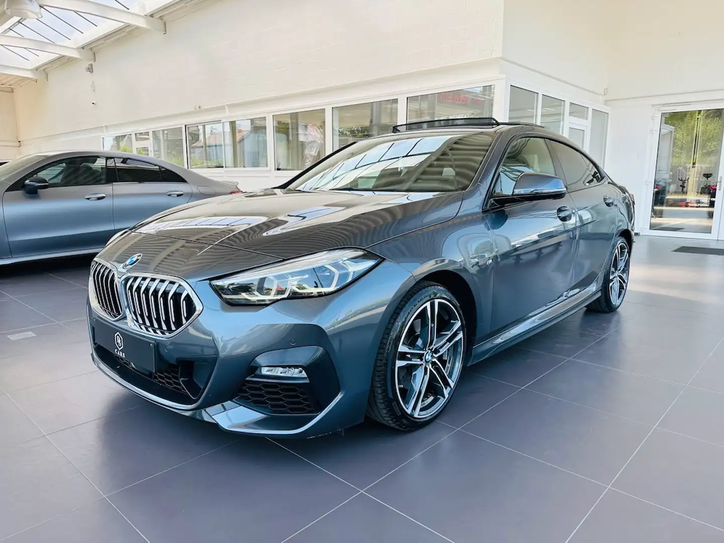 BMW 218 iA Gran Coupé ** GARANTIE +PACK M +TOIT PANO ** Zilver - 1