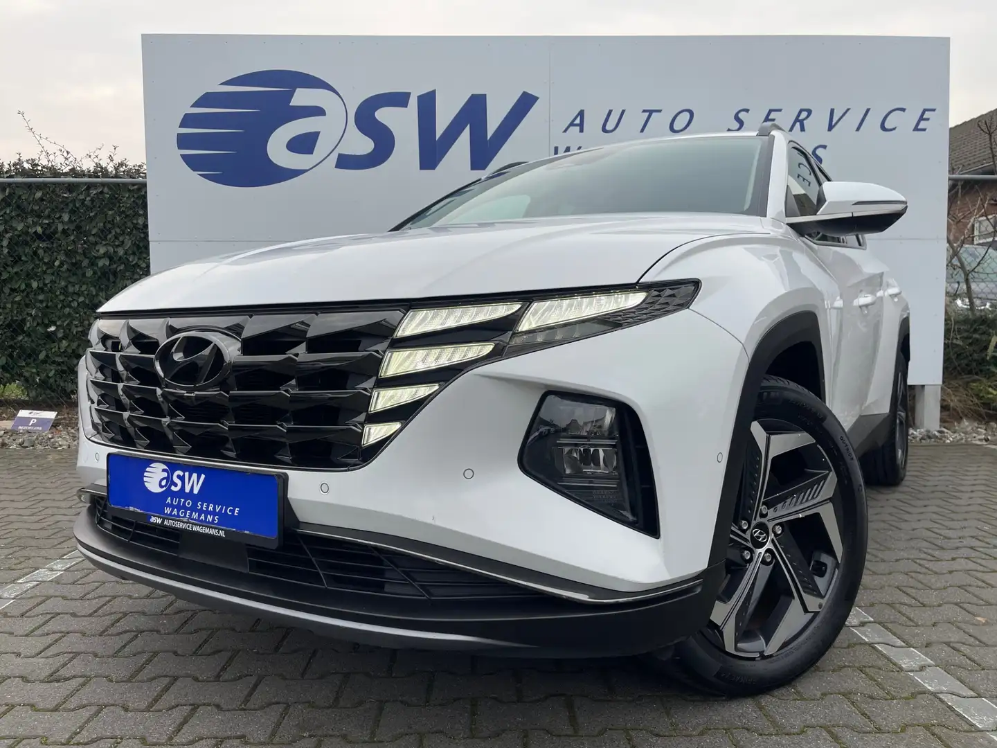 Hyundai TUCSON 1.6 T-GDI HEV Premium 4WD | Trekhaak | Leder | Car Wit - 2