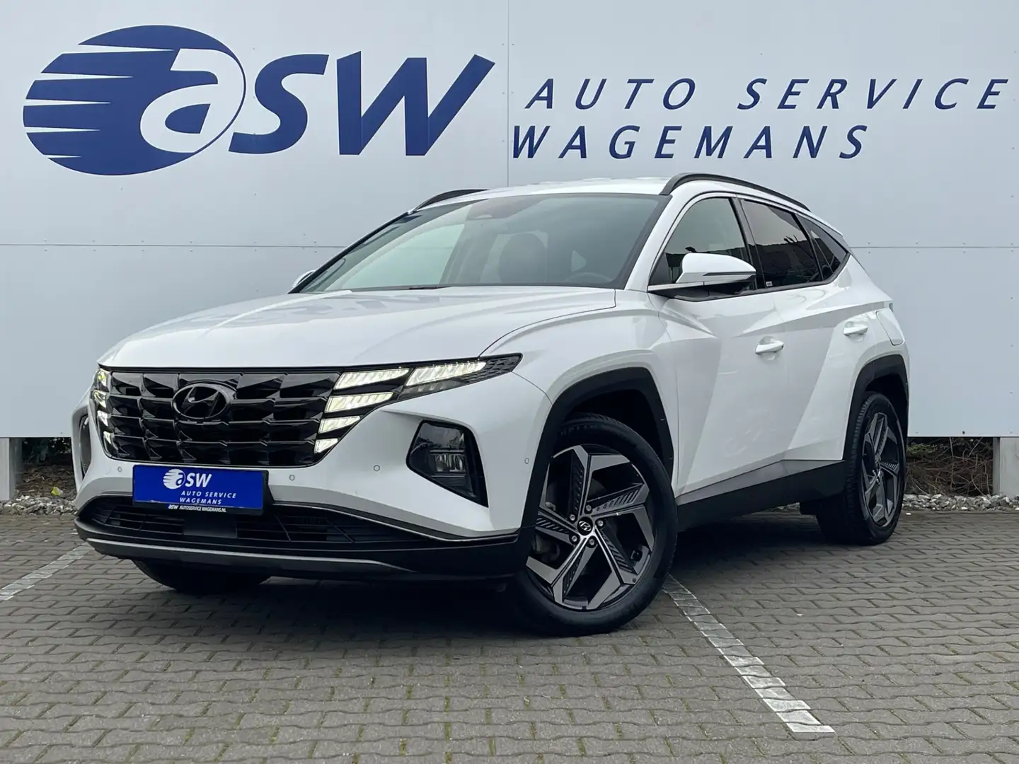 Hyundai TUCSON 1.6 T-GDI HEV Premium 4WD | Trekhaak | Leder | Car Wit - 1