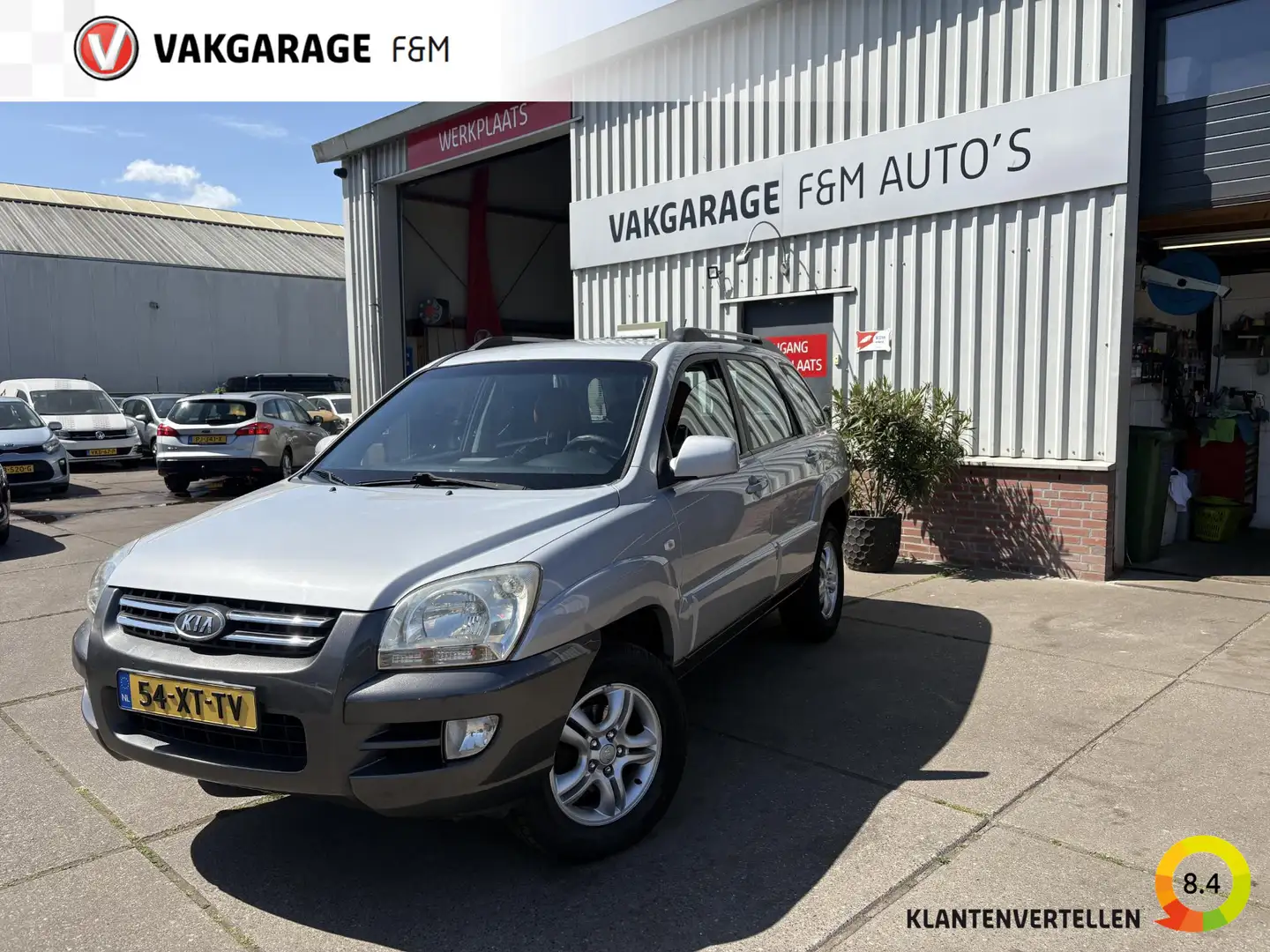 Kia Sportage 2.0 CVVT Executive Grijs - 1