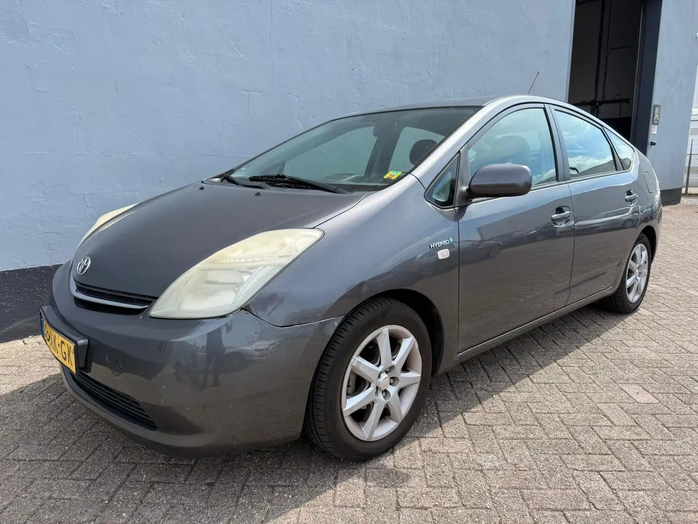 Toyota Prius 1.5 VVT-i Comfort Automaat - Dealer Onderhouden Gris - 1