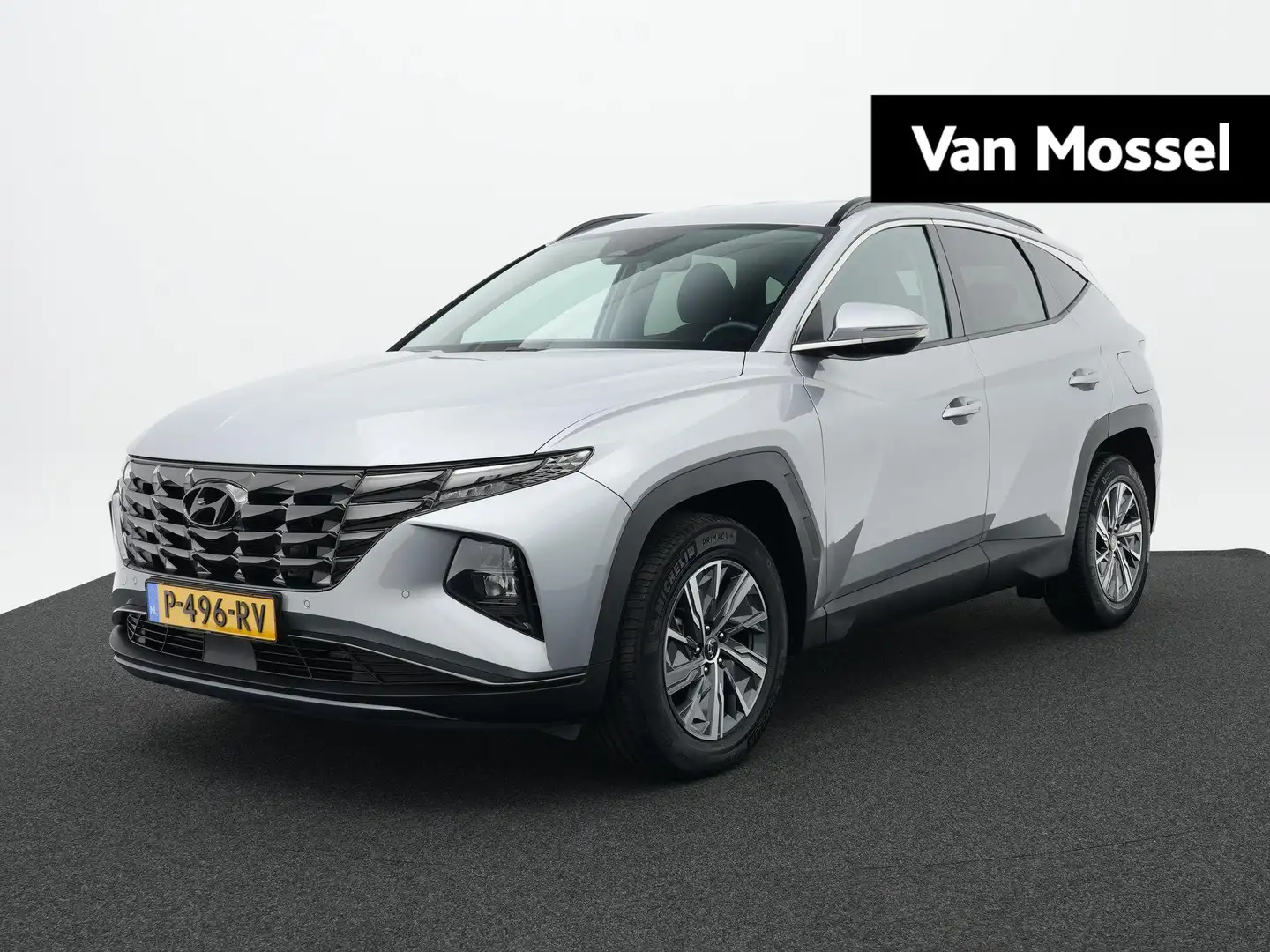 Hyundai TUCSON 1.6 T-GDI HEV Comfort Smart | Trekhaak | Cruise co Grau - 1