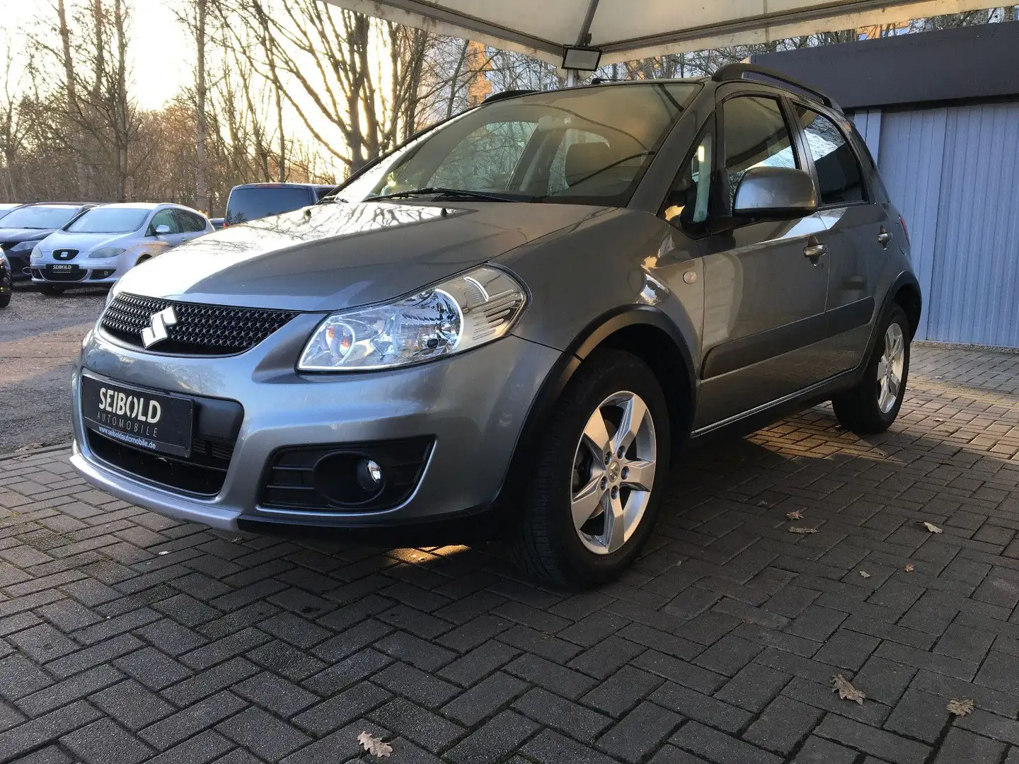 Suzuki SX4 Comfort 1.6 Autom/1.H/15TKM/Klimatr/Shz/PDC Grau - 1