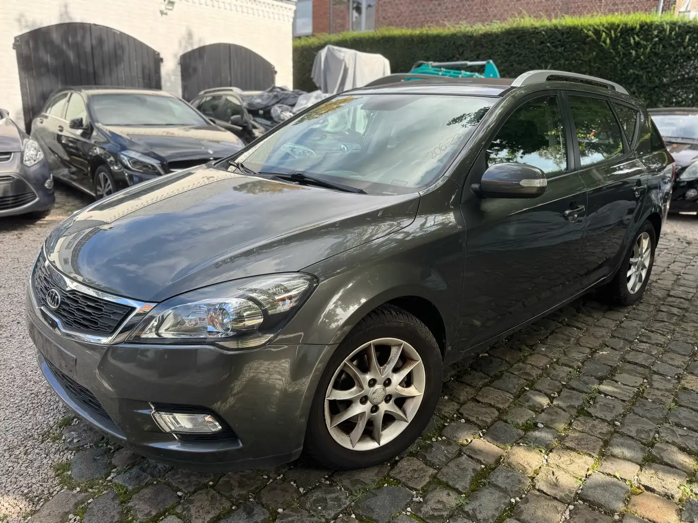 Kia Ceed SW / cee'd SW 1.6 CVVT AUTOMAAT - 82000KM - PDC - Zetelverwrmng Grijs - 1