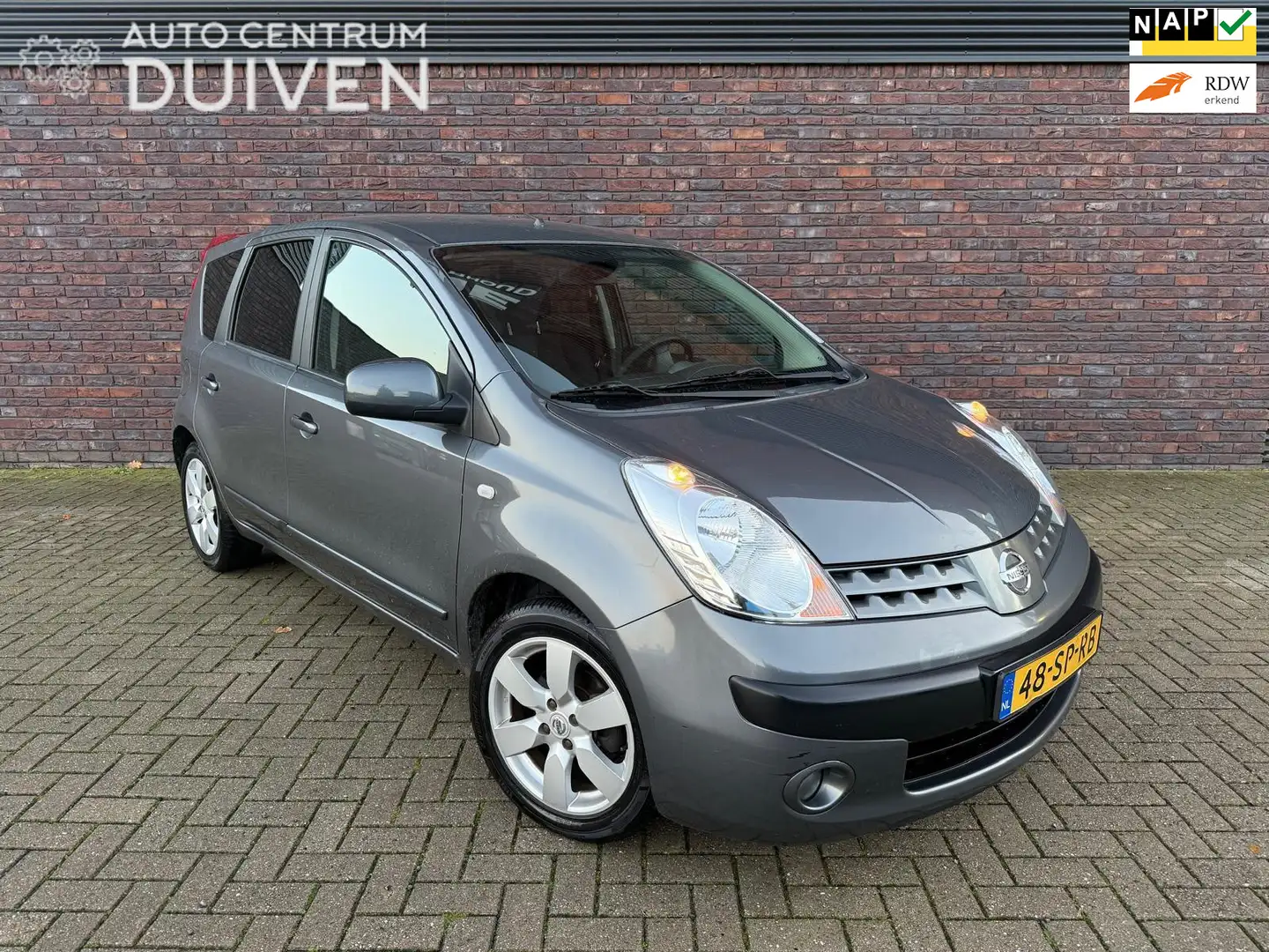 Nissan Note 1.4 | 1e Eigenaar | Nieuw APK | Airco | Trekhaak Grijs - 1
