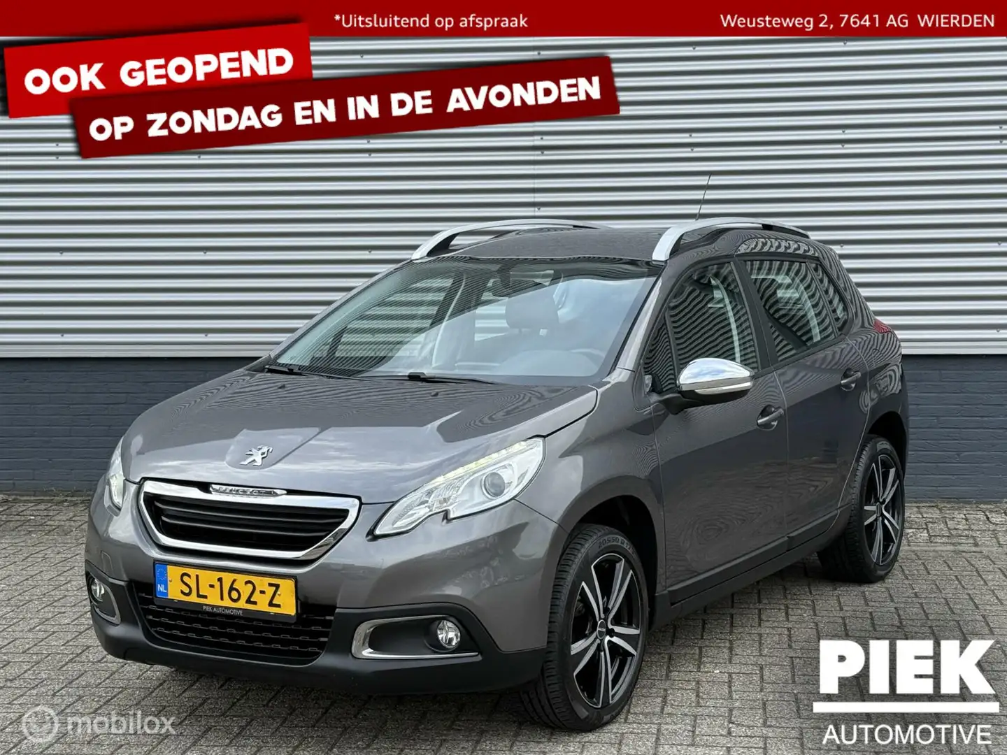 Peugeot 2008 1.2 VTi Allure Pack Premium Plus Grijs - 1