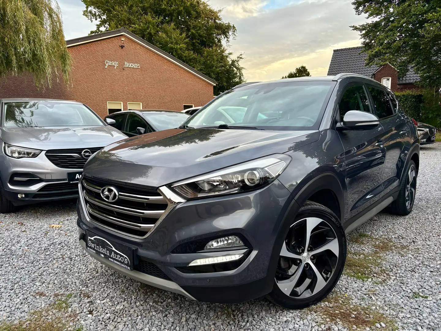 Hyundai TUCSON 1.6 GDI Premium-bijna alle extra's!-19 inch LMV Gris - 1