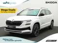 Skoda Karoq 1.5 TSI 150 pk DSG Sportline Business | Trekhaak | Wit - thumbnail 1