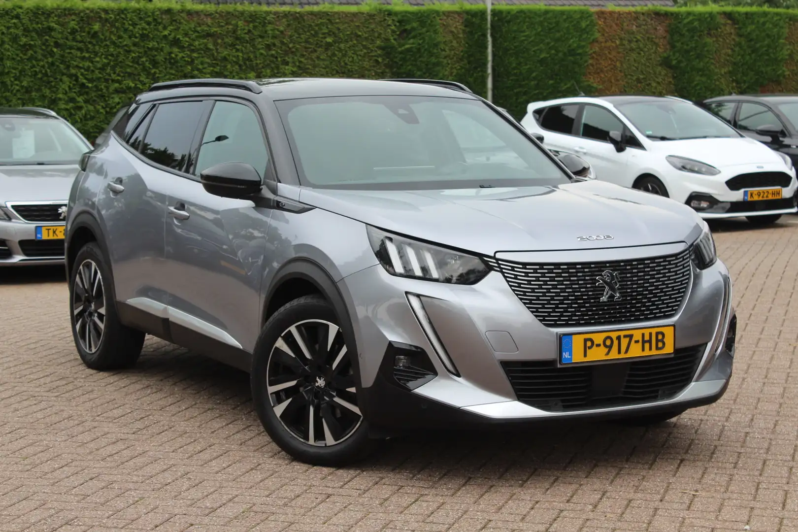 Peugeot e-2008 EV GT 50 kWh / SoH 90.6% / Camera / Half leder / V Grijs - 1